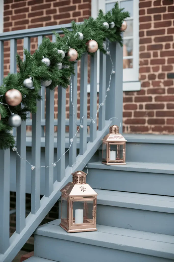 Porch decorated with metallic accents and glowing holiday lights.