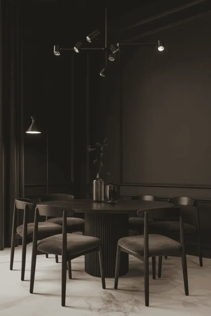 A dimly lit living room shrouded in shadows, illuminated by a dramatic pool of light from a single floor lamp, casting dramatic shadows on the walls. The room is sparsely furnished, with a large leather armchair and a minimalist side table in the foreground. The middle ground features a dark, wooden coffee table and a plush, oversized rug, while the background is obscured in darkness, creating a sense of depth and mystery. The lighting is warm and moody, with a slight vignette effect, drawing the viewer's attention to the central focal point. The overall atmosphere is one of cozy introspection and a subtle sense of melancholy.